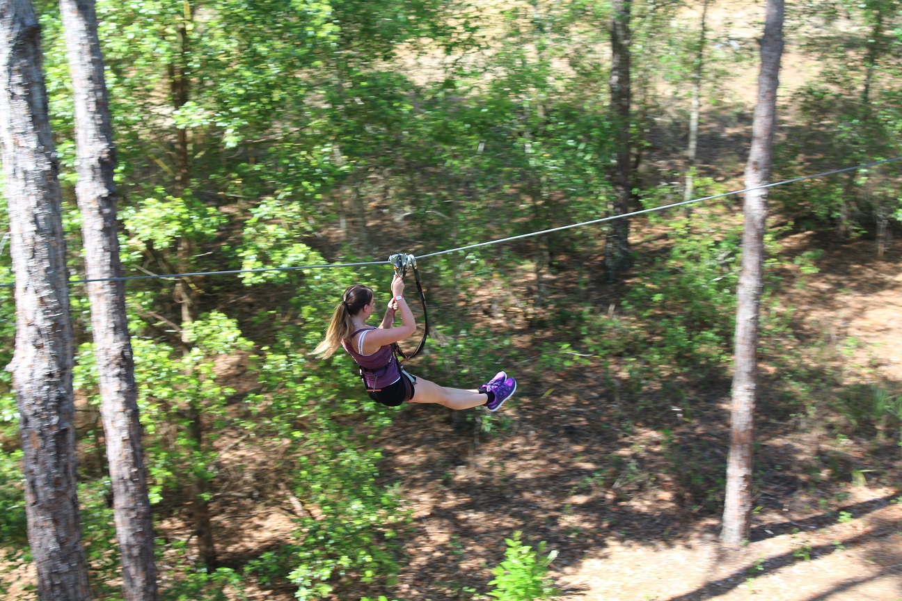 Woman ziplining at Orlando Tree Trek