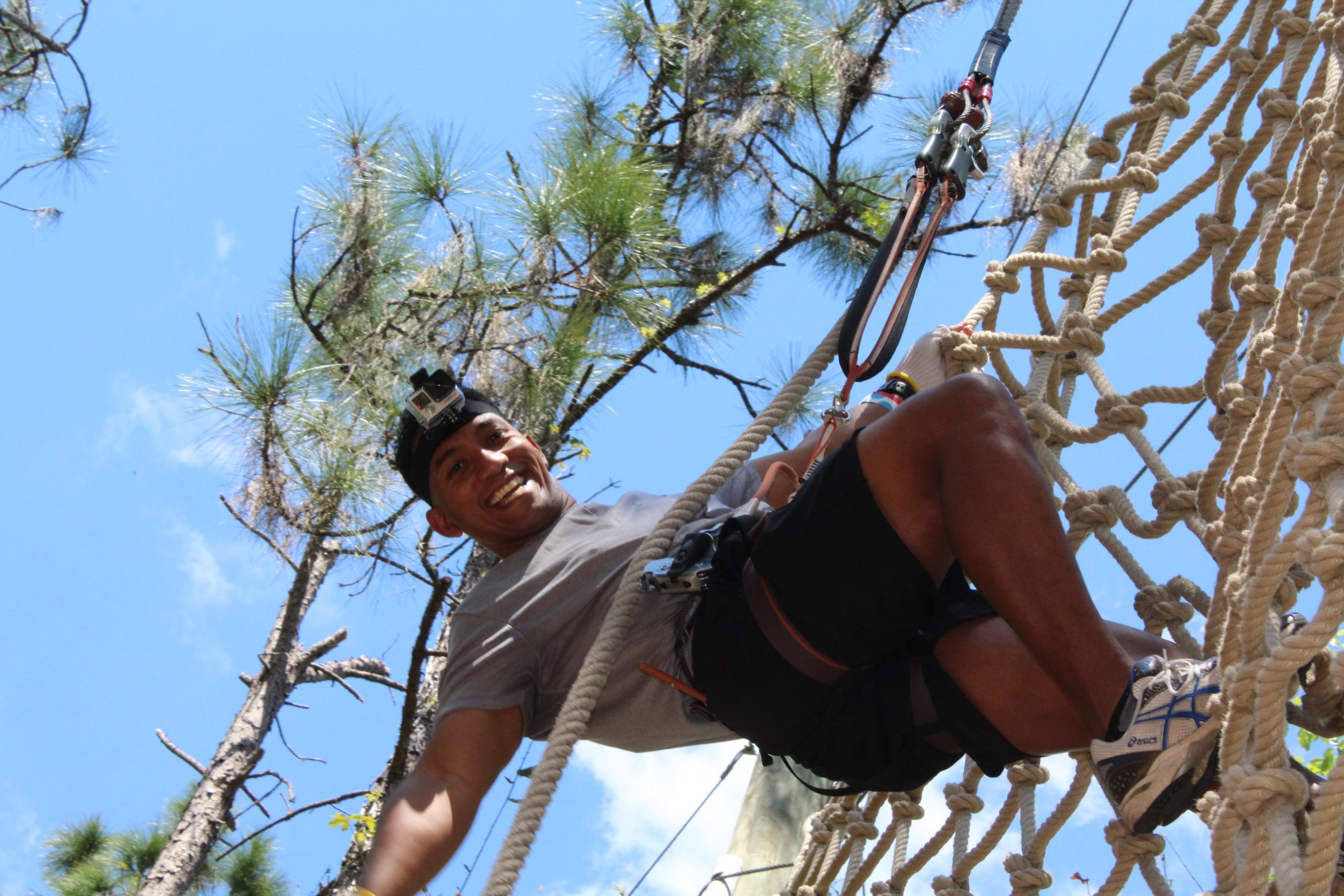 Man climbing rope net